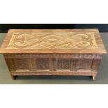 Miniature Furniture - a carved blanket box, scrolled plank top, leaf carved four panel front,