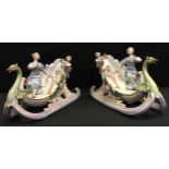 A pair of early 20th century continental porcelain figural sleigh vases, Swans head prows, painted
