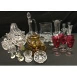 A set of six cranberry glass wine glasses, c.1860; cut glass flower basket; decanter; etc