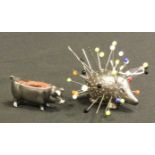 A Novelty silver pin cushion as a Hedgehog, London 1898, 15g gross; a white metal pin cushion as a