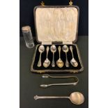 A set of six teaspoons, Birmingham 1948, cased; a Robert Allison Glasgow silver caddy spoon,