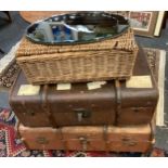 A brown luggage trunk, another; wicker basket, wall mirror (4)