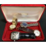 A 1950s Accurist 9ct gold cased wristwatch, textured silver dial, Arabic numerlas and baton markers,