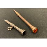 A silver slide action chatelaine pencil, unmarked, 2.1g gross, 51mm extended length; another rose