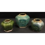 A Tang style Chinese stoneware vase, probably 19th century, and two conforming small vases, (3).