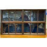 A pair of unusual Edwardian oak wall mounting two door display cabinets of small proportions, 26.5cm