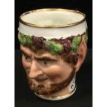 An early 19th century Derby type Young Bacchus cup, moulded with grape and vine chaplet, loop