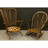 An Ercol Studio range Armchair, and Rocking Chair, with original patterned seat cushion ( the