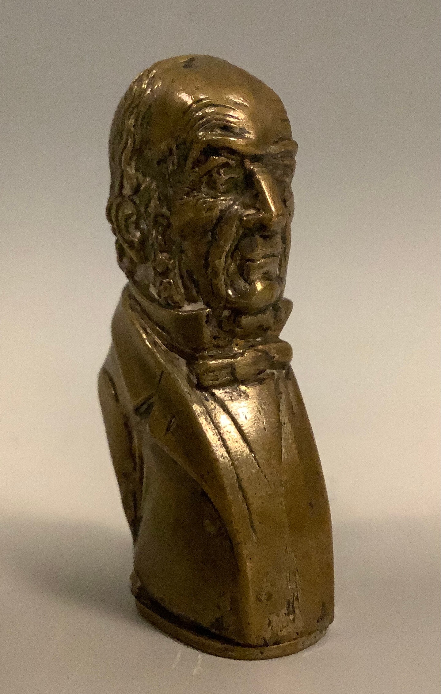 A novelty silvered brass vesta case, as William Gladstone, bust length, 5.5cm high, c.1900.