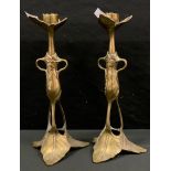 A pair of late 19th century Art Nouveau candlesticks, crown triform sconce, tapering floral open