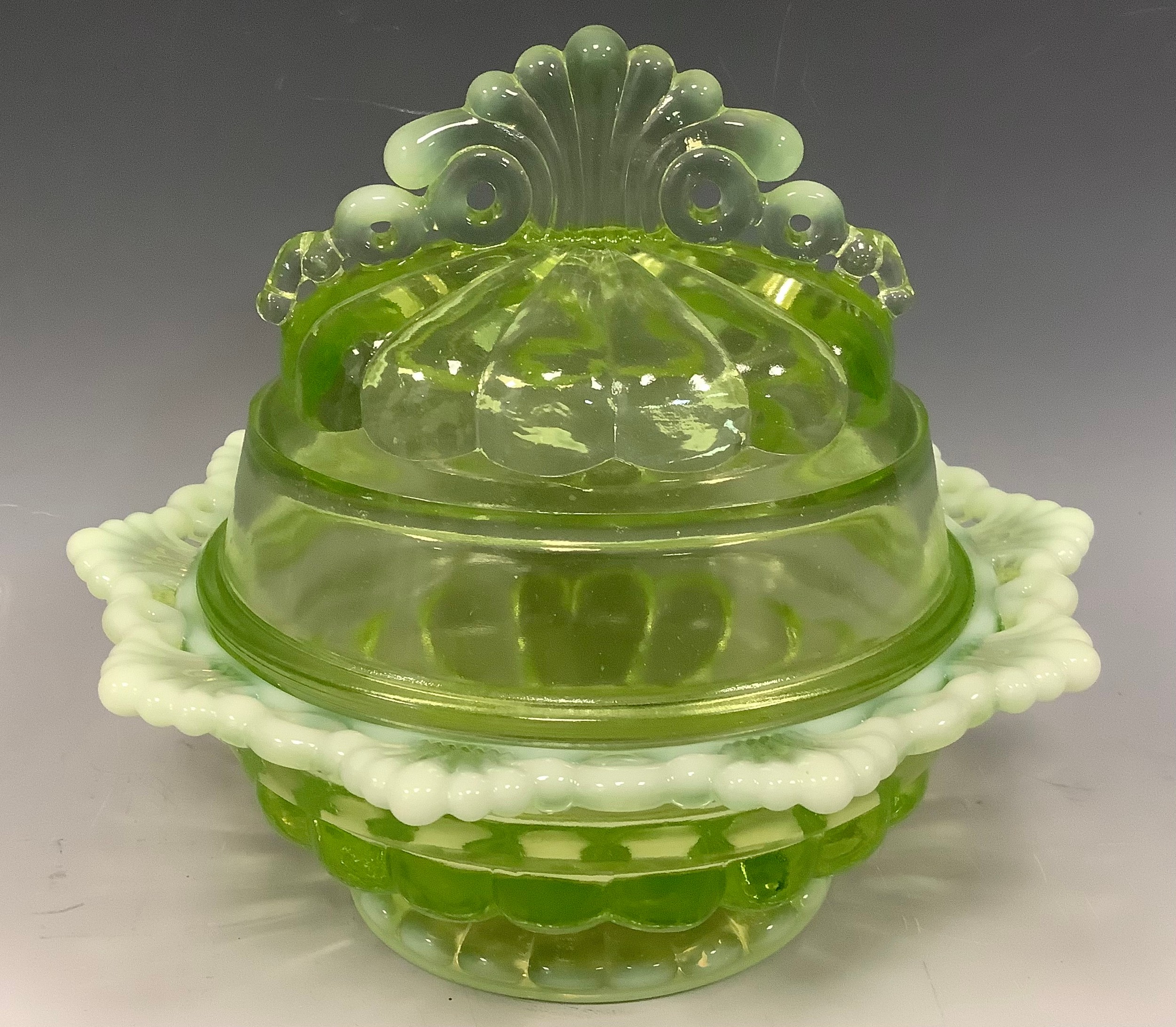 An early 20th century Westmoreland Company Vaseline Glass oval pedestal bowl and cover, 15cm tall - Image 2 of 2