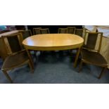 A 20th century teak extending dining table, oval top, 75cm high; a set of eight Nathan teak dining