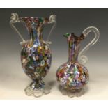 An early to mid 20th century Murano 'Millifiori' tall necked jug, scrolling 'serpentine' handle,