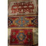 A Middle Eastern Chobi type rug or carpet, 180cm x 126cm; others, similar, 163cm x 70cm and 100cm