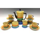 An Art Deco Carlton Ware coffee set for six, painted in rainbow bands, number /4653 3599, the coffee