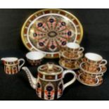 A Royal Crown Derby Imari 1128 pattern miniature cabaret set on tray, comprising teapot, milk and