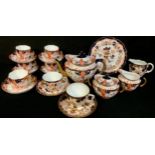 A Royal Crown Derby Imari 2712 pattern teapot, milk jug, sucrier and cover, four coffee cups and