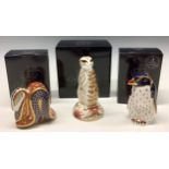 A Royal Crown Derby paperweight, Meercat, gold stopper, first quality, boxed; others, Rockhopper