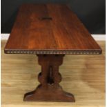 A large oak refectory trestle dining table, probably Rupert or Nigel Griffiths Monastic Woodcraft,