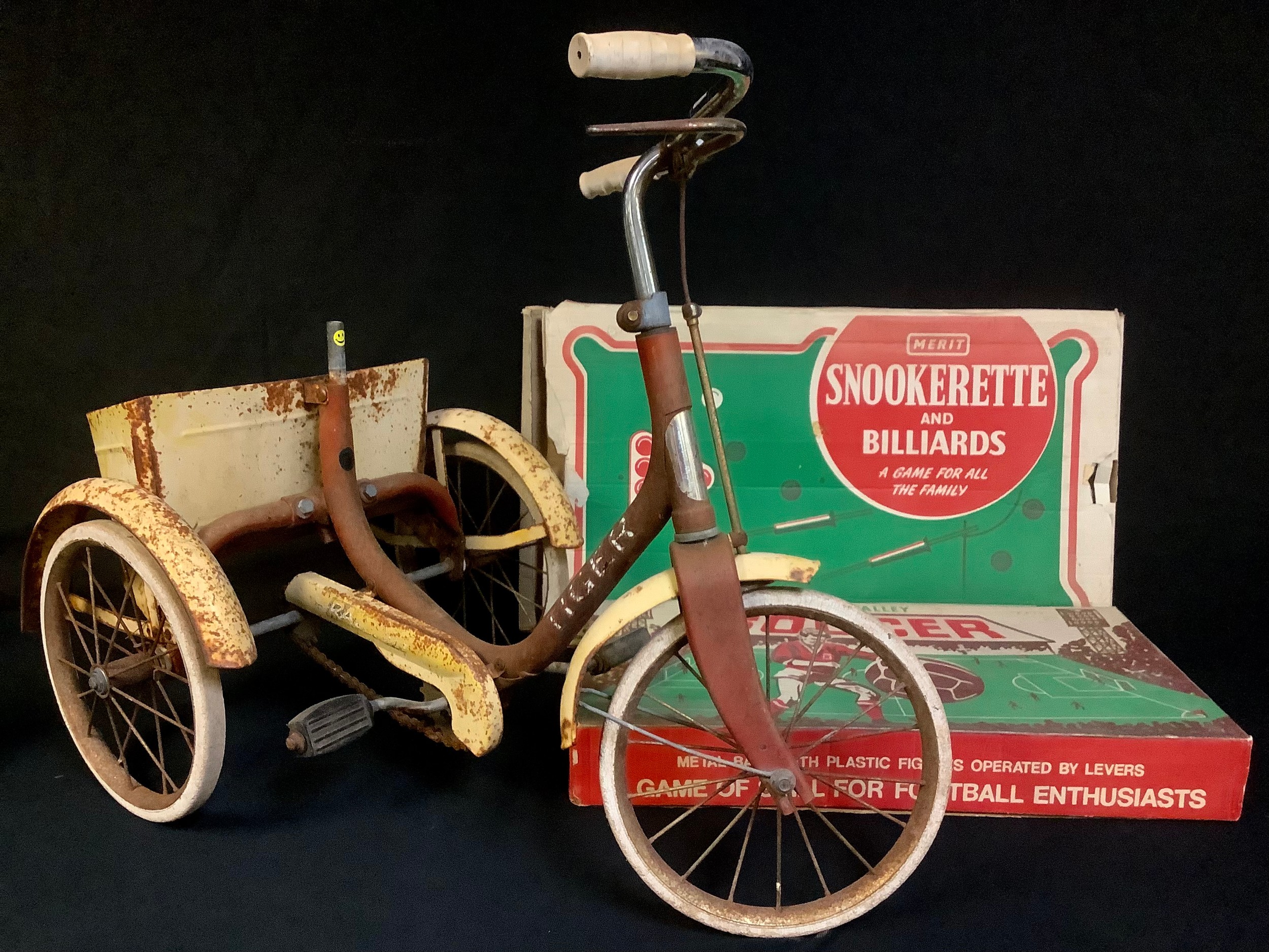 A Tri-Ang tricycle; a Chad Valley Soccer football game, boxed; a Merit Snookerette & Billiards