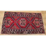 A Middle Eastern rectangular woollen rug, 138cm x 72cm