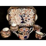 A Derby Crown Porcelain Company Imari palette associated cabaret set on tray, Old Japan pattern,