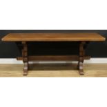 An oak refectory trestle dining table, probably Rupert or Nigel Griffiths Monastic Woodcraft,