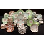A Royal Worcester Miranda part tea service, for six; two Royal Worcester plates; other tea ware -