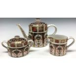 A Royal Crown Derby Imari 1128 pattern bachelor's teapot, milk jug, sucrier and cover, 15cm high,