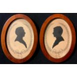 English School (early 20th century), a pair of silhouettes, oval, mahogany frames