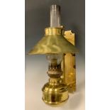 A late 19th century Adjustible Brass wall mounted oil lamp, converted for use with electricity.