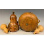 A Late 19th century Corsican decorated gourd, depicting a scene from daily life; along with a 19th