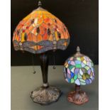 A Tiffany style side light, the dome shaped with dragonflies, 55cm high; another, smaller (2)