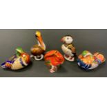 A Royal Crown Derby paperweight, Puffin, printed mark, gold stopper; others, Mandarin Duck, Carolina