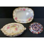 A Royal Crown Derby Pinxton Roses pattern oval tureen and cover; conforming meat plate; 1128 Imari