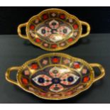 A Royal Crown Derby 1128 pattern two handled shaped oval dishes, 22cm wide, printed mark (first)