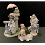 A Lladro figure girl with lambs, 3546, printed and impressed marks; others young girl with parasol