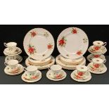 A Royal Albert Poinsette dinner and tea service, for nine