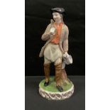 A Sampson Hancock Derby figure, The Tinker, he stands, wearing a broad brimmed tricorn hat, carrying