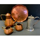 A WMF copper three piece coffee service, with angular and wicker brass handles, the pot 21cm high,