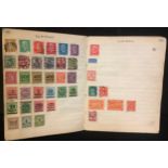 Stamps - a small All World collection in a notebook, early 20th century