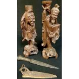 A Sudanese dagger, 23cm long; a pair of Chinese hardwood carved figures (3)