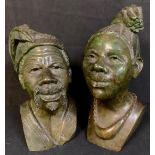 A pair of green soapstone busts, of an African tribesman and woman, 20cm high