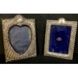 A Victorian silver photograph frame, 18cm, London 1897; an Edwardian silver photograph, heart shaped