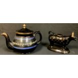 A Victorian Jackfield cow creamer, with cover; a similar teapot (2)