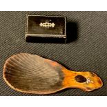 A Georgian tortoiseshell silver inlaid caddy spoon; a papier mache snuff