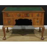 A George II style writing desk, rectangular top with gadrooned edge above an arrangement of four