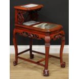 A Chinese inspired hardwood two-tier jardiniere stand, inset dreamstone type panels, ball and claw