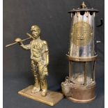 An Eccles miner's lamp, Protector lamp Lighting, type GRS; a brass model of a miner, 20cm (2)
