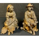 A pair of 19th century French spelter clock garnitures, modelled as peasant musicians, the highest